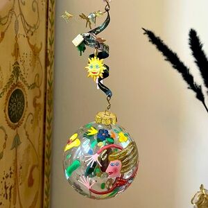 Hand painted glass ornament with charms inside.  PERFECT gift for a gardener.